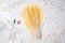 Uncooked pasta spaghetti macaroni and italian flag on floured white background. Food travel italian cuisine concept