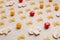 Uncooked pasta, tomatoes, mushroom slices and spices on a beige background, top view, close-up. Cooking, fettuccine, yellow and