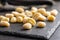 Uncooked potato gnocchi on cutting board. Tasty italian food