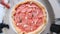 Uncooked raw italian pizza with lots of mozzarella and sausage