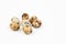 Uncooked scattered Quail eggs on white background top view, healthy food concept