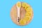 Uncooked spaghetti on a wooden board, blue background. Italian raw pasta. View from above. Pasta in a wooden spoon.