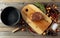 Uncooked steak in sauce with spices an rosemary on a old wooden table