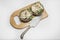 Uncooked Stuffed portabello mushrooms on wood board