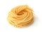 Uncooked tagliolini pasta nest