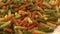 Uncooked three-colored italian pasta. Dried italian pasta on a wooden table