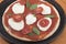 Uncooked tomato, basil and mozzarella pizza