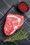 Uncooked wagyu Rib Eye steak, raw beef meat. Black background. Top view