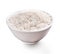 Uncooked white rice in bowl isolated