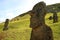 Uncountable gigantic abandoned Moai statues on Rano Raraku volcano with many visitors, Easter Island, Chile