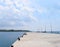 Uncrowded Ferry Jetty with Open Sea and Cloudy Sky