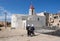 Undefined Arabian women walk next to St. John Baptist Catholic Church at old Acre city