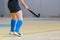 Undefined female indoor hockey player with stick