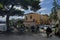 Undefined locals people and tourist relaxing at nice outdoor cafe near marina and pier in Catania, Sicily, Italy