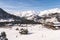 Undefined people skiing and snowboarding in Slopes of Grandvalira ski area of Pyrenees Mountains in Andorra