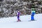 An undefined small skiers on the track of the competitionin