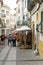 Undefined tourists shopping in the main street of the Evora.