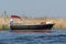 Undefined young couple women resting on boat floating on river