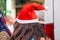 Undefined young woman wear santa hat