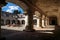 Under the arches of the courtyard of Capuchins Monastery in Antigua de Guatemala, Guatemala