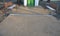 Under the bench are rectangles made of tiles. otherwise, the soft surface of the compacted gravel park path could erode the shoes