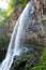 Under big jungle waterfall Giant. tropical landscape of Abkhazia. Vertical