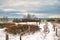 Under a cloudy Winter sky, a wooden boardwalk passes through the Kohler Dunes