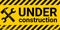 Under construction site banner sign vector black and yellow diagonal stripes under construction, hammer and wrench