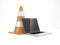 Under construction. Traffic cone and laptop