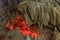 Under the ground. Beautiful view of stalactites and stalagmites in an underground cavern - New Athos Cave. Sacred