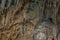 Under the ground. Beautiful view of stalactites and stalagmites in an underground cavern - New Athos Cave. Sacred