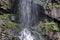 Under part of fresh Boyana waterfalls in deep forest and rock, Vitosha
