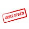 Under review red rubber stamp isolated on white.