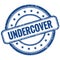 UNDERCOVER text on blue grungy round rubber stamp