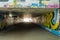 Underground crossing with graffiti smeared walls