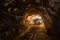 Underground gold mine passage with rails
