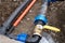 Underground irrigation system with elbow fitting of pvc pipes at bend with yellow tap or faucet