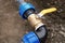 Underground irrigation system with elbow fitting yellow tap or faucet