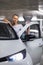 Underground parking garage - young woman with her car in the underground parking