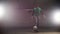 Underground parking. A young soccer man training football tricks. Balancing the ball on the foot