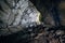 Underground river flowing through large oviform underground turning sewer tunnel