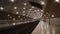Underground subway tunnel with bright lighting. Action. Simple stone interior of underground metro with bright lighting