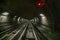 Underground tunnel perspective rails with red light signal