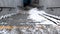 Underpass stairs covered with snow, slippery granite stairs