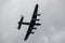 Underside of a Lancaster bomber flying away from the camera