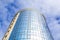 Underside panoramic and perspective view to steel blue glass high rise building skyscrapers, industrial architecture