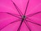 Underside of a pink umbrella