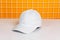 With understated charm, a white blank hat enhances this captivating mockup image