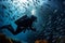 Underwater adventure, scuba diver immersed, fishes in mesmerizing formation