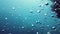 Underwater air bubbles in the clean azure blue ocean.